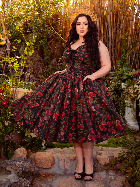 Wrap yourself in the Ambrosia Dress in Pomegranate Print, a timeless piece of gothic glamour. Its flowing silhouette and luxurious fabric make it perfect for moonlit gatherings and midnight rendezvous.