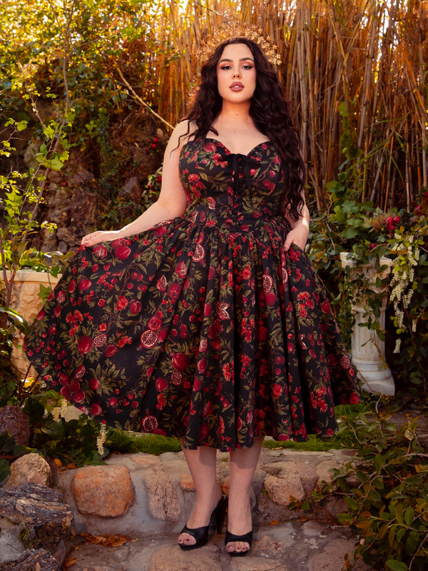 The Ambrosia Dress in Pomegranate Print is a vision of gothic beauty. Its elegant design and rich crimson hues create an air of mystery and enchantment, ideal for twilight soirées and whispered secrets.