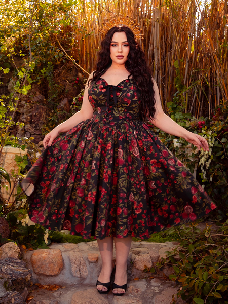 Embrace the gothic sophistication of the Ambrosia Dress in Pomegranate Print. Its elegant silhouette and rich crimson hues create a captivating aura, ideal for moonlit gardens and shadowy encounters.