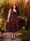 The Ambrosia Dress in Pomegranate Print is a hauntingly beautiful piece. Its sleek design and flowing fabric create an air of mystery and enchantment, perfect for twilight gatherings and midnight dances.