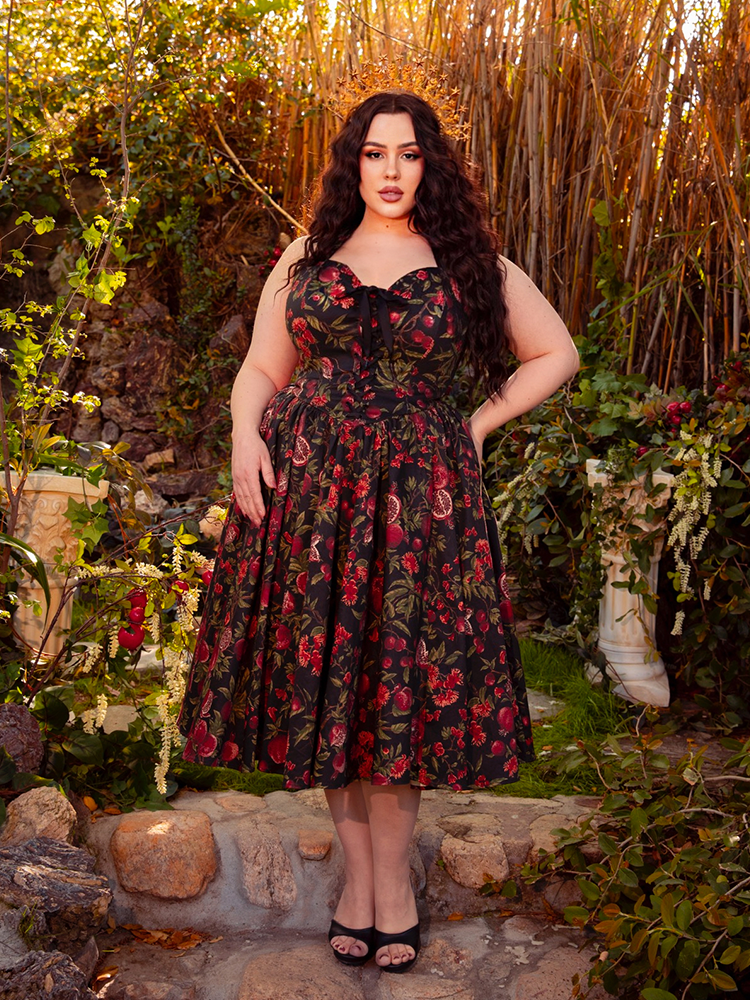 Draped in the Ambrosia Dress in Pomegranate Print, you'll exude gothic elegance. Its sleek silhouette and rich crimson hues create a mesmerizing aura, perfect for moonlit gatherings and enchanting nights.