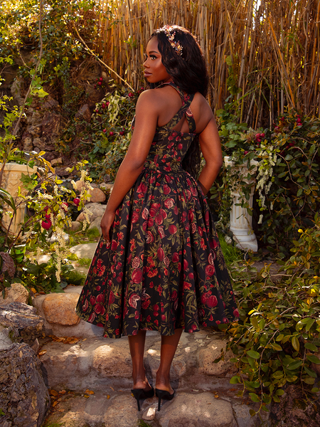 Step into gothic elegance with the Ambrosia Dress in Pomegranate Print. Its sleek silhouette and luxurious fabric create an air of timeless beauty, ideal for moonlit gatherings and midnight rendezvous.