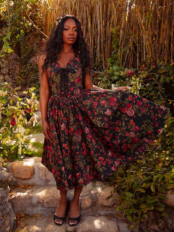 Embrace the night with the Ambrosia Dress in Pomegranate Print. This timeless piece, with its elegant silhouette and rich crimson hues, is ideal for twilight gatherings and moonlit walks.