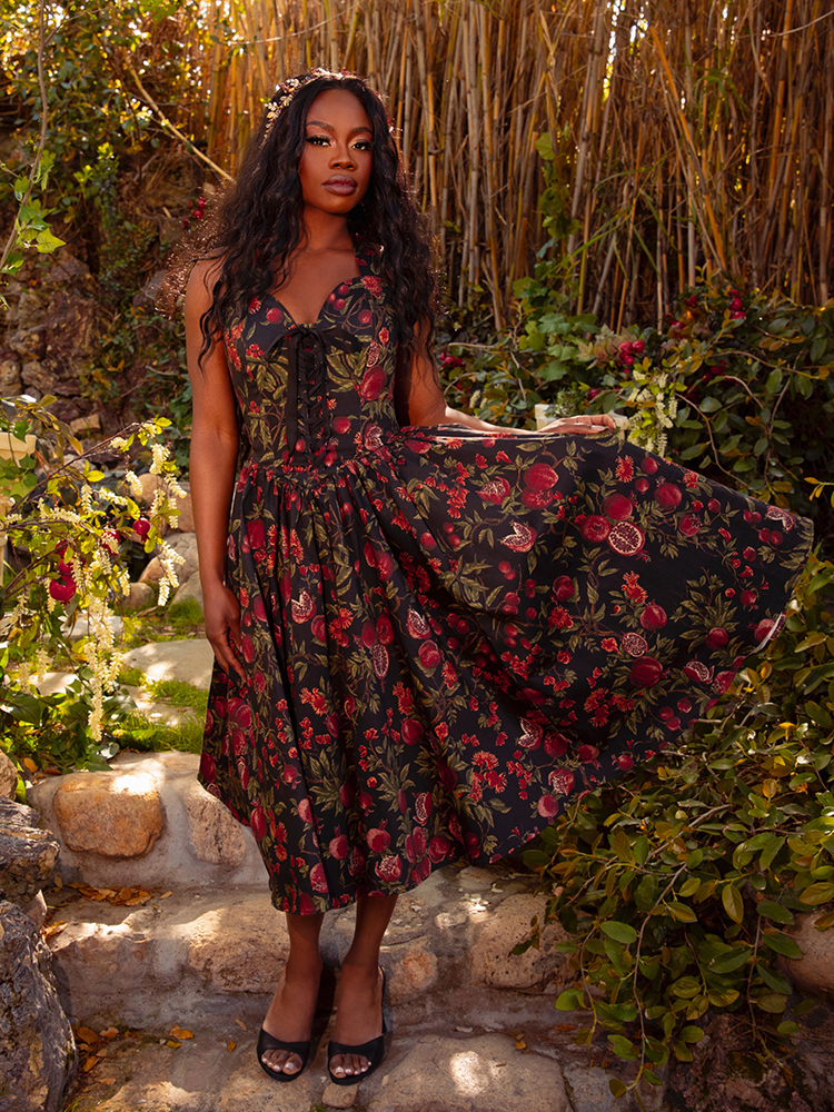 Embrace the night with the Ambrosia Dress in Pomegranate Print. This timeless piece, with its elegant silhouette and rich crimson hues, is ideal for twilight gatherings and moonlit walks.