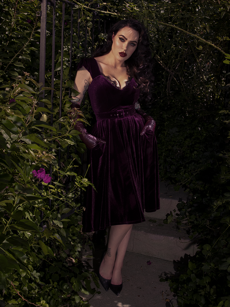 A detailed shot of the plum fabric, showing the lush, matte finish and precise stitching of the bodice.