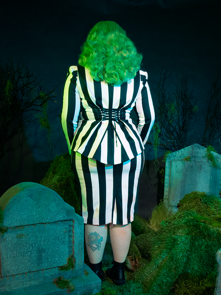 A playful nod to macabre style, the BEETLEJUICE™ Corset Blazer combines classic stripes with a form-fitting silhouette for a look that’s hauntingly unforgettable.