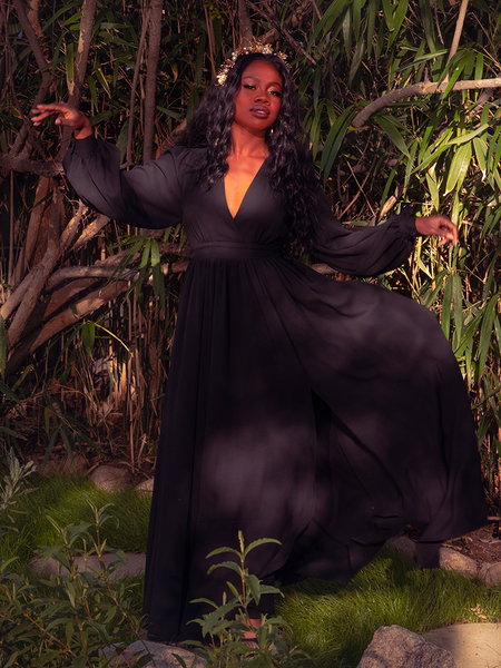 The Belladonna Maxi Dress in Black is a masterpiece of gothic romance. Its exquisite, floor-length design and rich black fabric exude an air of mystery and sophistication. Ideal for candlelit dinners or secretive gatherings, this dress whispers tales of eternal beauty.