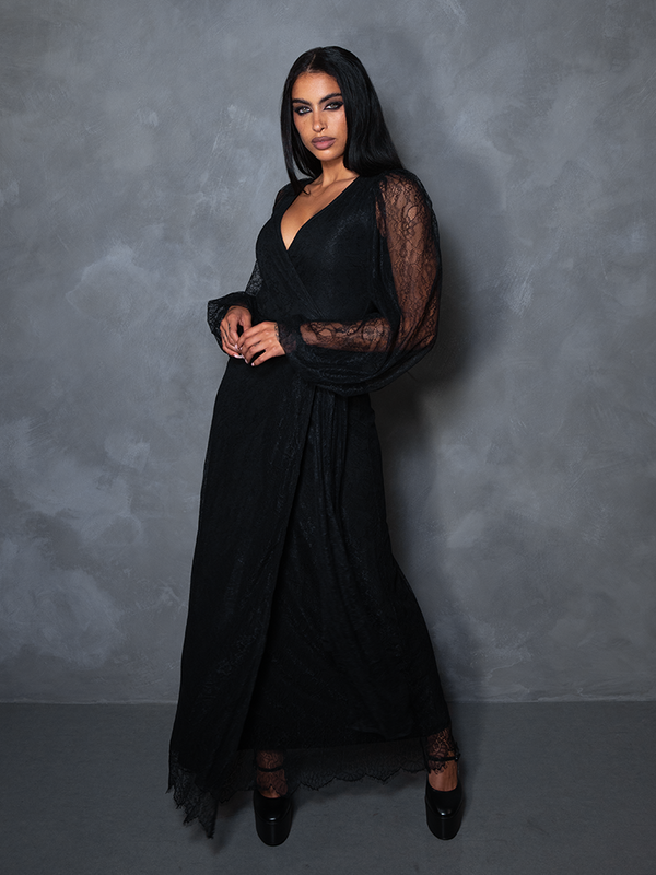 Model posing in the Black Widow Wrap Gown in Black Lace, exuding haunting luxury and macabre beauty.