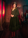 Mesmerizing models bring forth the hauntingly beautiful Victorian Velvet Bustle Skirt in Olive from the gothic fashion label La Femme en Noir.