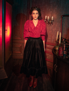 Embrace the enchantment of gothic fashion with models revealing the hauntingly gorgeous Victorian Velvet Bustle Skirt in Black from La Femme en Noir.