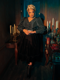 The gothic clothing brand La Femme en Noir shines as models showcase the hauntingly gorgeous Victorian Velvet Bustle Skirt in Black.
