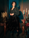 Embark on a journey into gothic fashion with models presenting the hauntingly gorgeous Victorian Velvet Bustle Skirt in Black from La Femme en Noir.