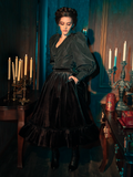Step into the hauntingly beautiful world of La Femme en Noir as models reveal the Victorian Velvet Bustle Skirt in Black with captivating allure.