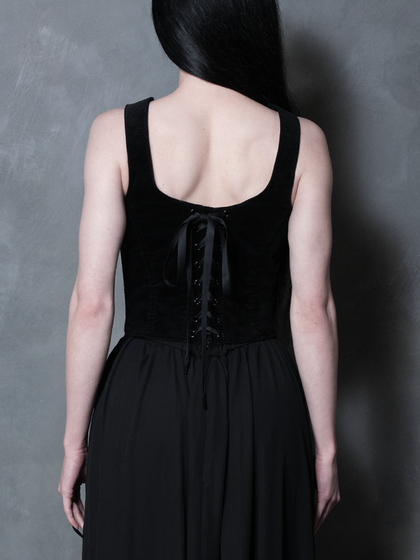 Detailed shot of the intricate lace-up back of the black velvet Countess Corset, a classic nod to romantic Whimsigoth and traditional Victorian Goth fashion.
