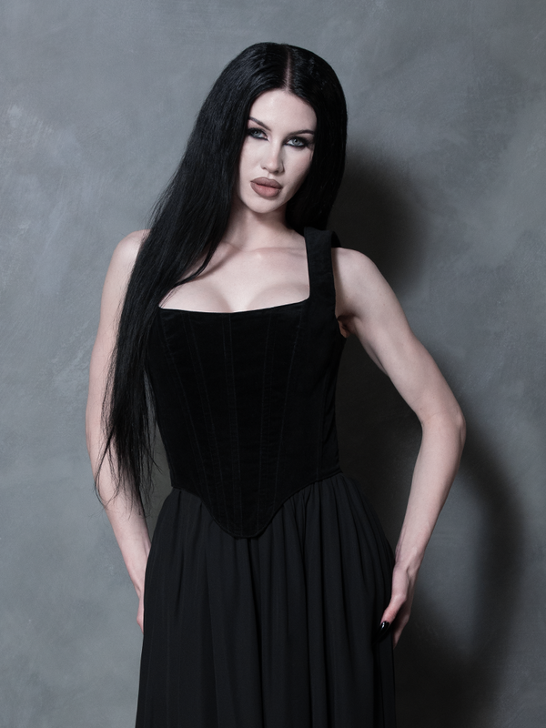 Front angle of a model demonstrating the supportive, contouring fit of the bodice, a definitive staple of romantic gothic glamour.