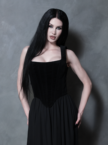 Front angle of a model demonstrating the supportive, contouring fit of the bodice, a definitive staple of romantic gothic glamour.