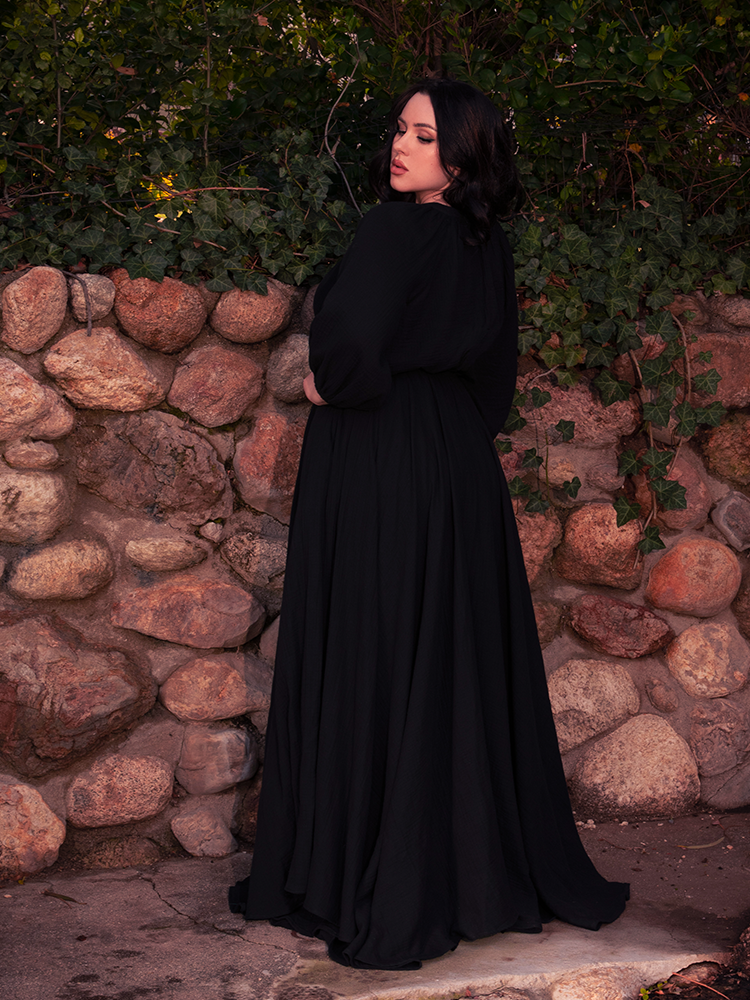 A belted waist enhances this gothic clothing design, adding edge to enchantment.