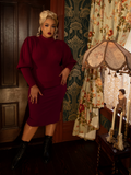 Designed for modern-day pin-ups, the Vamp Pencil Skirt in Oxblood boasts a curve-loving silhouette in a rich, sultry shade, perfect for vintage-inspired styling.