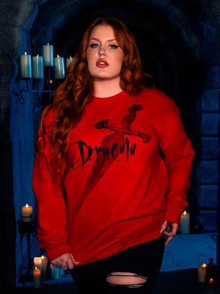 A stunning human female model dons the "Love Never Dies" Sweatshirt in Red from the BRAM STOKER'S DRACULA collection by gothic clothing brand La Femme en Noir.