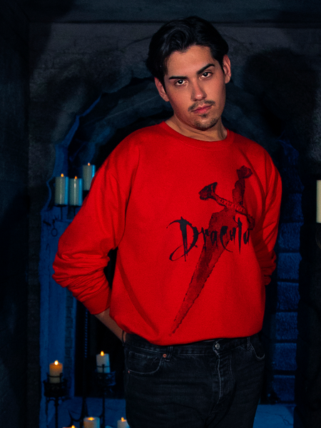 In a captivating display, a female human model dons the "Love Never Dies" Sweatshirt in Red, a masterpiece from gothic clothing brand La Femme en Noir's BRAM STOKER'S DRACULA collection.