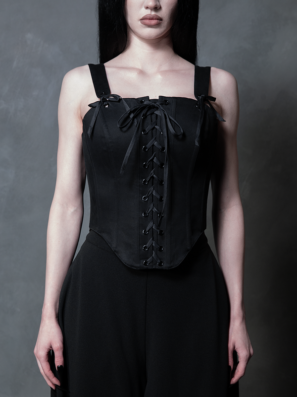 A female model channel a timeless Victorian goth aesthetic, enveloped in the rich texture of a dark, structured corset.