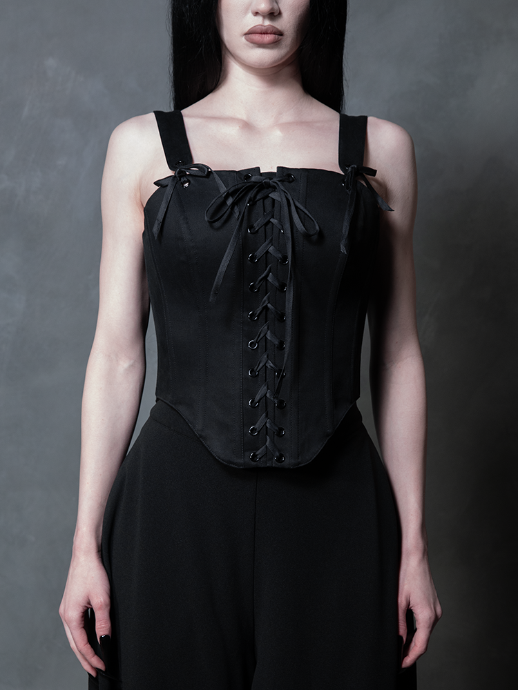 A female model channel a timeless Victorian goth aesthetic, enveloped in the rich texture of a dark, structured corset.