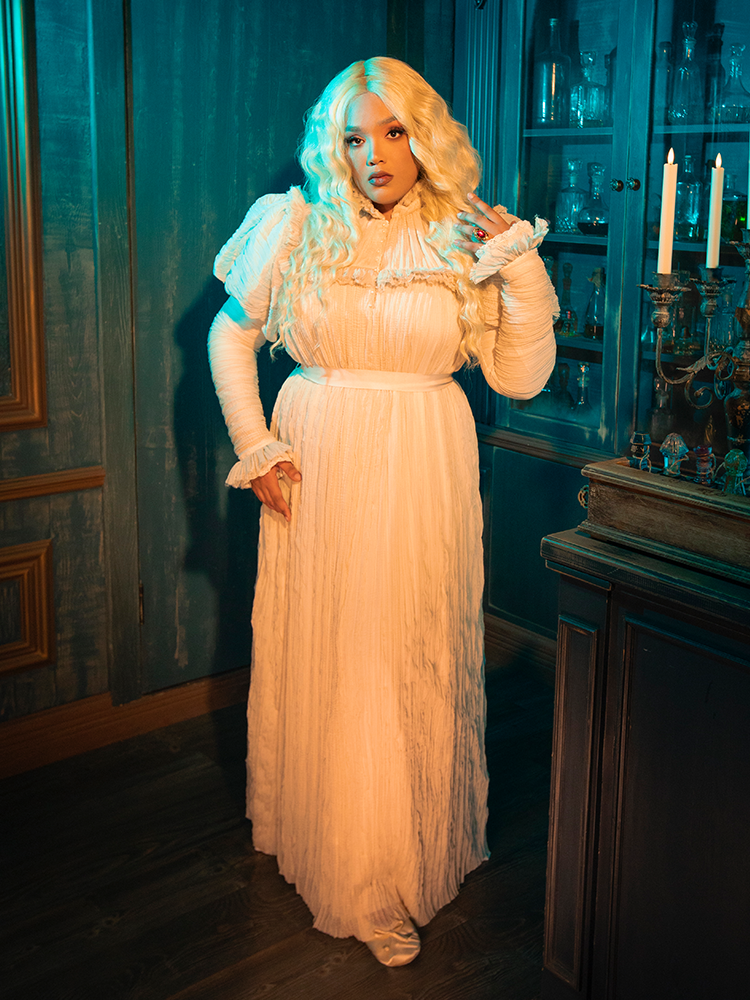 The CRIMSON PEAK™ Edith Victorian Gown is a timeless whisper, a gentle reminder of a past filled with opulence and mystique. The ivory fabric, soft as a dream, paired with the finesse of the lace, evokes a sense of nostalgia for a time when beauty was a form of rebellion.