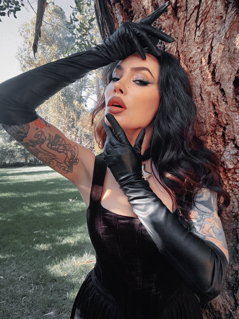 Close-up of the gloved fingertips, showcasing a sleek fit that maintains a feminine aesthetic while embracing a bold, gothic style.