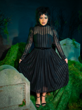 The Funeral Dress in Black is a haunting vision of gothic refinement. Its long, dramatic sleeves and floor-length design capture a mournful elegance, ideal for those who wish to blend darkness with grace in their twilight escapades.