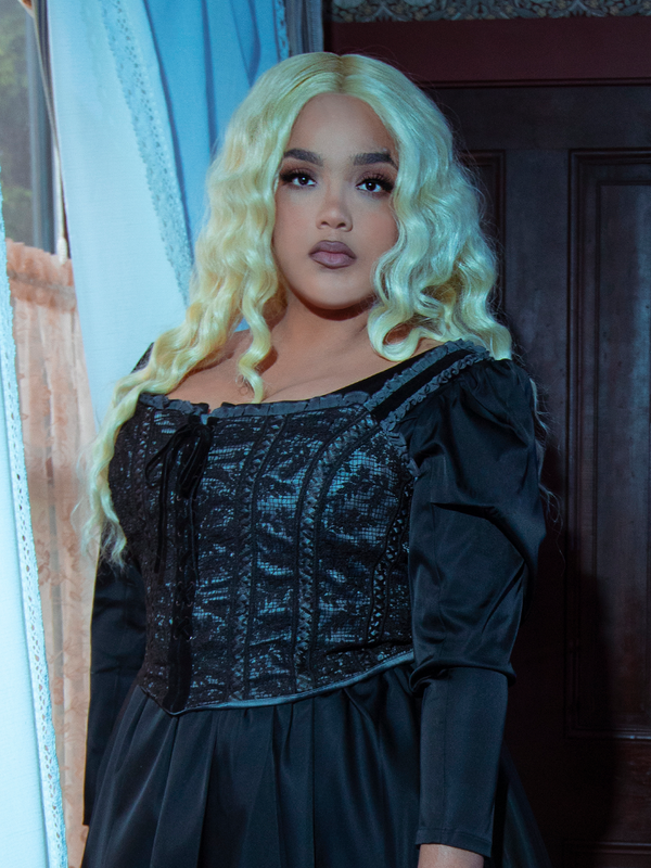 Dressed in the exquisite Gothic Glamour Bustier in Black, a female model commands a powerful, mysterious aura perfect for any gothic style clothing collection.