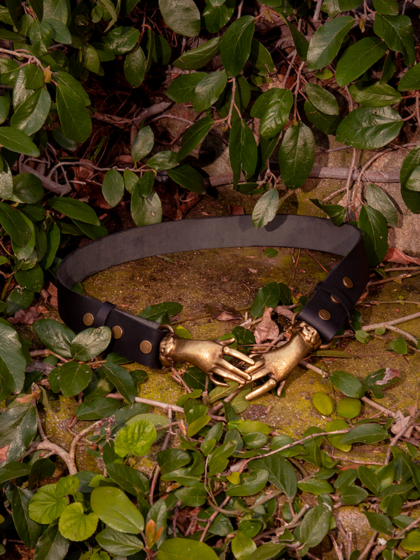Prepare to be mesmerized by the otherworldly beauty of the model graced in the Victorian Hands Belt in Antique Brass, a haunting treasure brought forth by the gothic craftsmanship of La Femme en Noir Clothing.