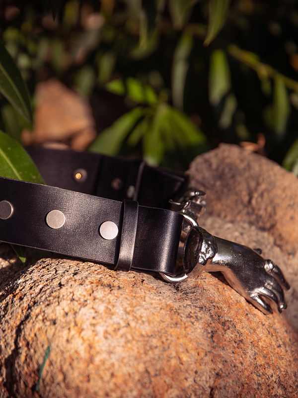 La Femme en Noir's gothic clothing line features a mesmerizing model showcasing the elegance of the Victorian Hands Belt in Silver.