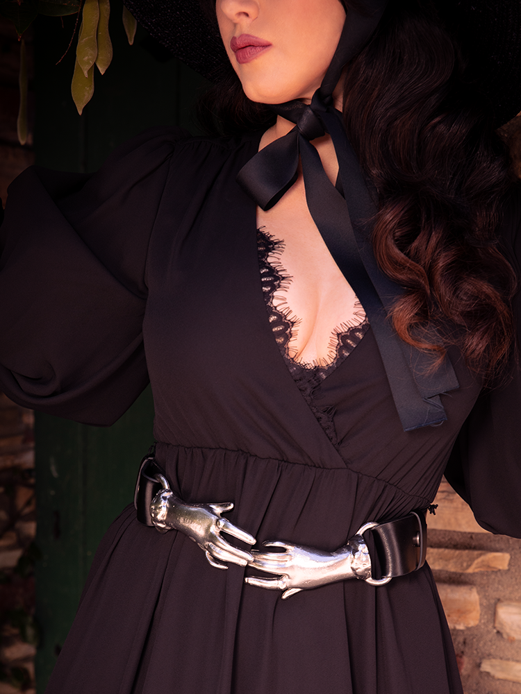 La Femme en Noir presents a spellbinding model donning the Victorian Hands Belt in Silver, epitomizing their gothic clothing aesthetic.