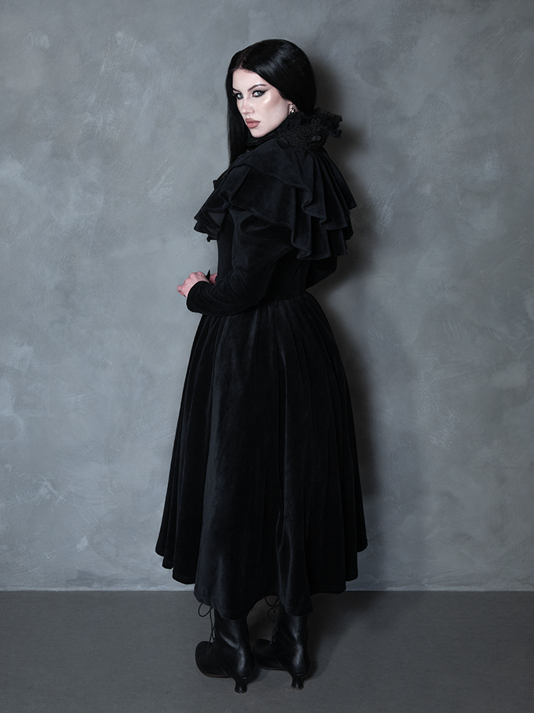 Female model wearing the Haunted Beauty Victorian Mourning Dress & Capelet Set in Black, channeling vampire aesthetic luxury and timeless mystique.