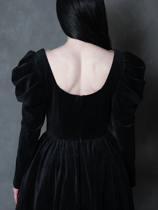 Model styled in the Haunted Beauty Victorian Mourning Dress & Capelet Set in Black, highlighting moody formalwear and antique noir grandeur.