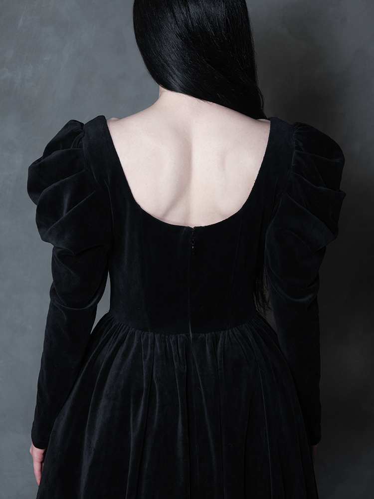 Model styled in the Haunted Beauty Victorian Mourning Dress & Capelet Set in Black, highlighting moody formalwear and antique noir grandeur.