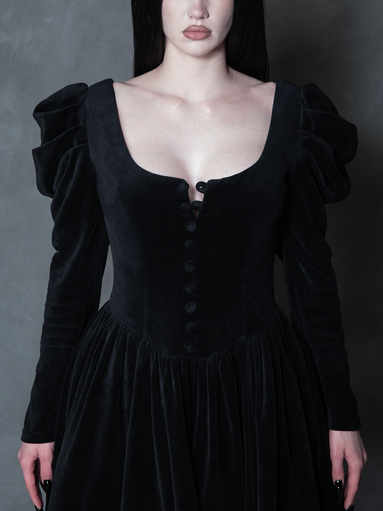 Model styled in the Haunted Beauty Victorian Mourning Dress & Capelet Set in Black, capturing victorian gothic clothing aesthetics and atmospheric charm.