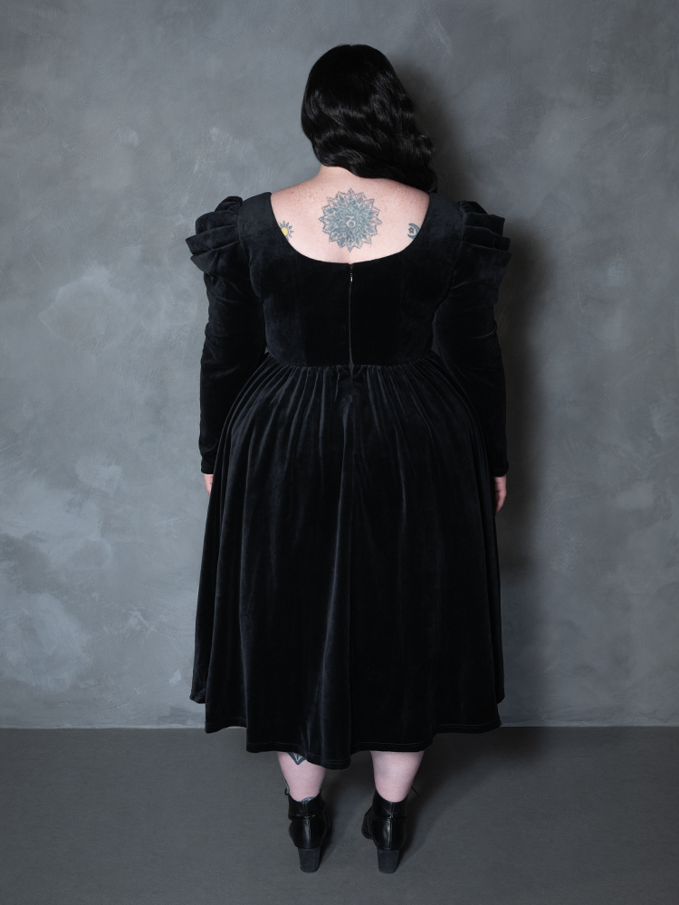 Model styled in the Haunted Beauty Victorian Mourning Dress & Capelet Set in Black, manifesting dark luxury and high-fashion mourning attire.