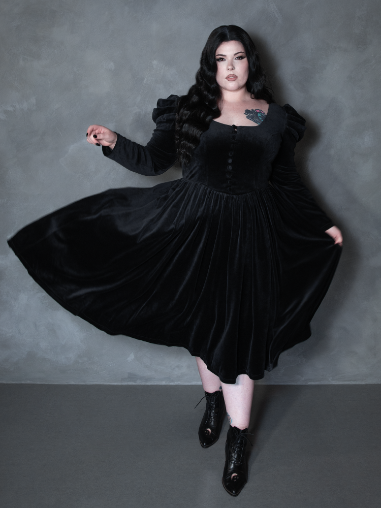 Female model wearing the Haunted Beauty Victorian Mourning Dress & Capelet Set in Black, evoking gothic maxi gown charm and ethereal dark drama.