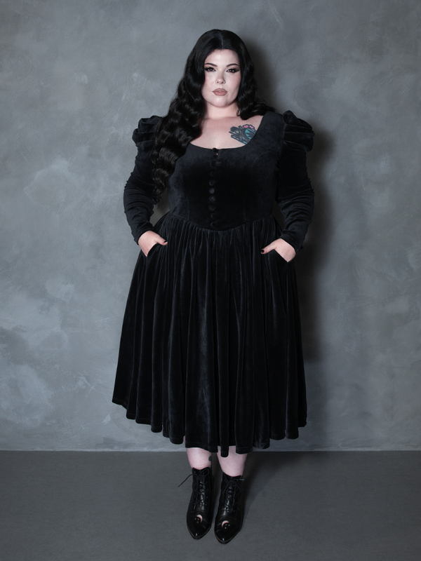 Model styled in the Haunted Beauty Victorian Mourning Dress & Capelet Set in Black, personifying vampiric elegance and shadowy beauty.