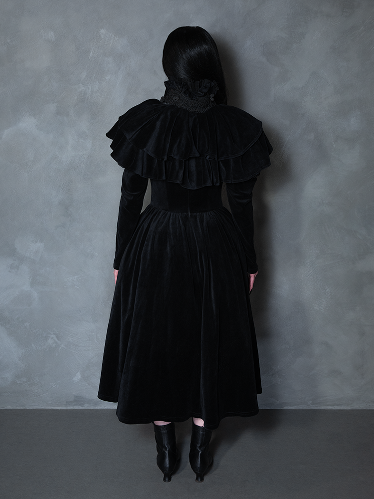 Model styled in the Haunted Beauty Victorian Mourning Dress & Capelet Set in Black, personifying macabre fashion drama and cinematic presence.