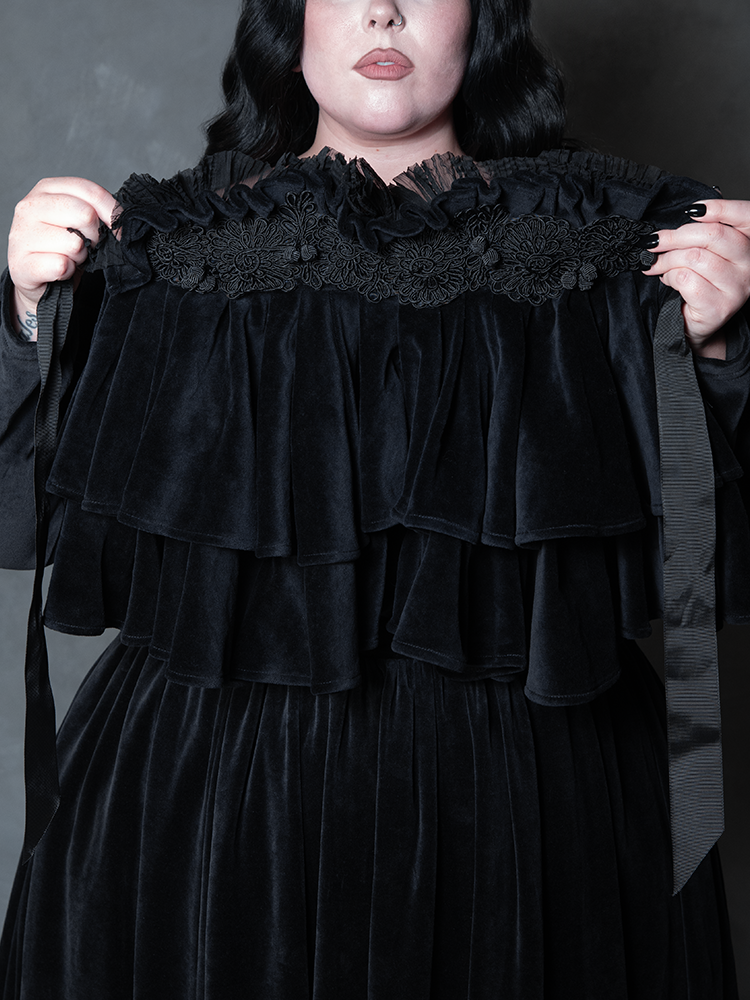 Female model wearing the Haunted Beauty Victorian Mourning Dress & Capelet Set in Black, showcasing victorian noir style and macabre romance.