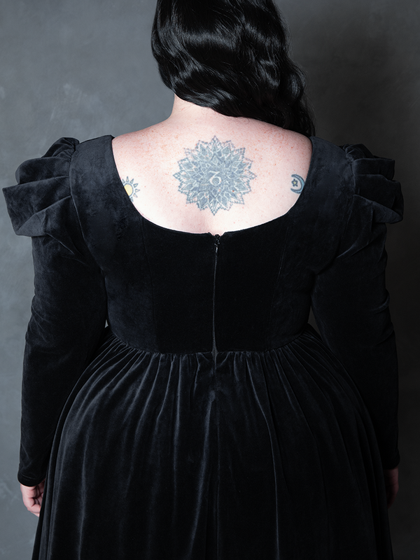 Model styled in the Haunted Beauty Victorian Mourning Dress & Capelet Set in Black, channeling shadowy luxury and cinematic gothic clothing.