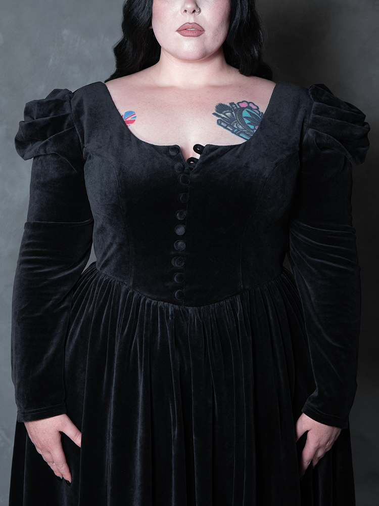 Model styled in the Haunted Beauty Victorian Mourning Dress & Capelet Set in Black, embodying gothic romanticism and dramatic sophistication.