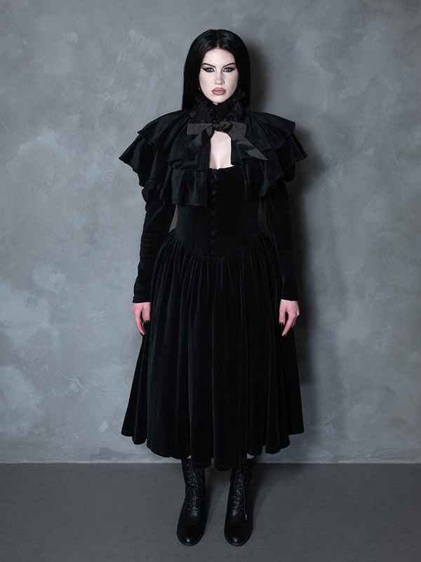 Model styled in the Haunted Beauty Victorian Mourning Dress & Capelet Set in Black, reflecting dark academia clothing trends and bewitching sophistication.