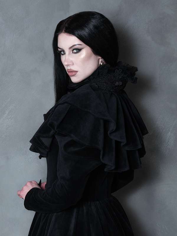 Female model wearing the Haunted Beauty Victorian Mourning Dress & Capelet Set in Black, capturing vintage-inspired dark fashion and haunting romance.