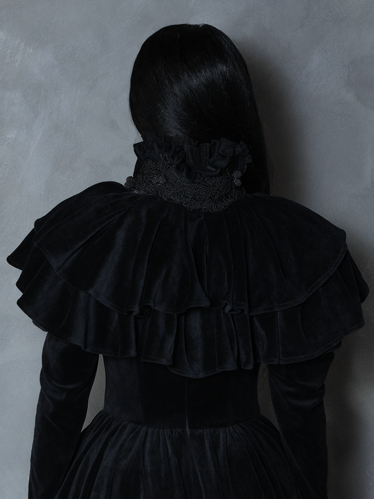 Model styled in the Haunted Beauty Victorian Mourning Dress & Capelet Set in Black, channeling midnight drama and vintage dark royalty.