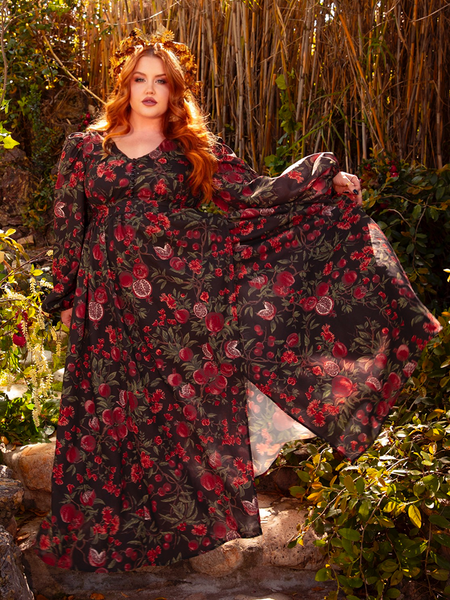 The Heroine Maxi Dress in Pomegranate Print is a dark, romantic masterpiece. Its deep crimson hues and elegant silhouette evoke the spirit of gothic poetry and forbidden love.