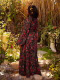 Adorn yourself in the Heroine Maxi Dress in Pomegranate Print, a masterpiece of gothic elegance. With its deep red hues and ethereal design, it whispers of dark romance and timeless allure.