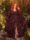 Draped in the Heroine Maxi Dress in Pomegranate Print, you'll embody the essence of gothic glamour. Its rich, deep red pattern and flowing silhouette create an aura of enchanting mystery.